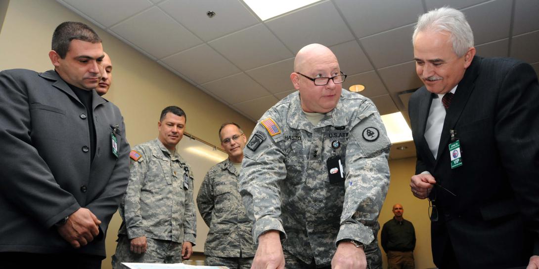 Tennessee’s adjutant general, Maj. Gen. Terry “Max” Haston of the Army National Guard, reviews a map of Bulgaria’s area of operation with Bulgarian Armed Forces cybersecurity officials at Tennessee’s Joint Force Headquarters in 2014. Bulgaria is investing in a national cyber defense system and collaborating with the U.S. government to mirror efforts such as optimizing public-private partnerships.