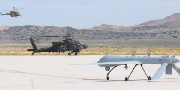 The OH-58D Kiowa Warrior, AH-64D Apache Longbow and Warrior Alpha land at Michael Army Airfield, Utah, in 2011, after the Manned-Unmanned Systems Integration Capability exercise. The aircraft joined with the RQ-11B Raven and MQ-5B Hunter to demonstrate their interoperability.
