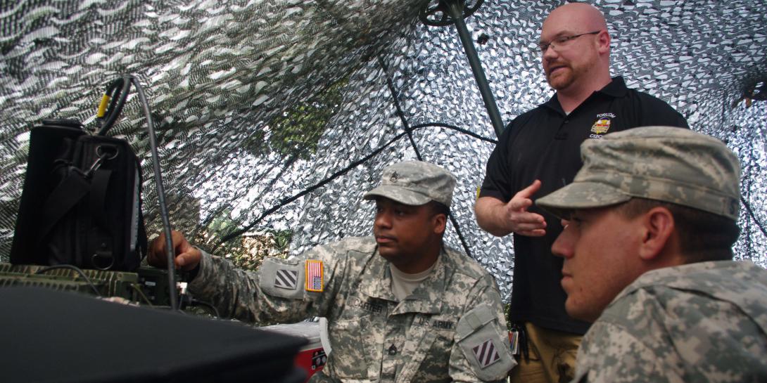 U.S. soldiers and an electronic warfare (EW) trainer observe the spectrum of frequencies used for communications during the Marne Focus exercise in June. A group of EW personnel test reaction times by jamming their communications during the exercise.