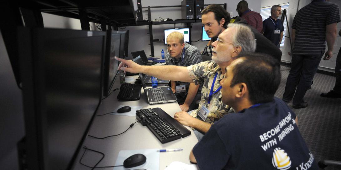 Government and private sector industrial control systems (ICS) professionals participate in an ICS cybersecurity training exercise at the Department of Homeland Security’s Industrial Control Systems-Cyber Emergency Response Team (ICS-CERT) training facility in Idaho Falls, Idaho.