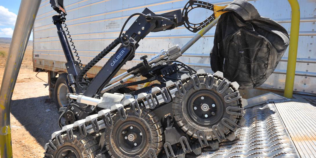 A bomb disposal robot removes a suspicious package during a training operation at Sandia National Laboratories. (Photo by Randy Montoya)