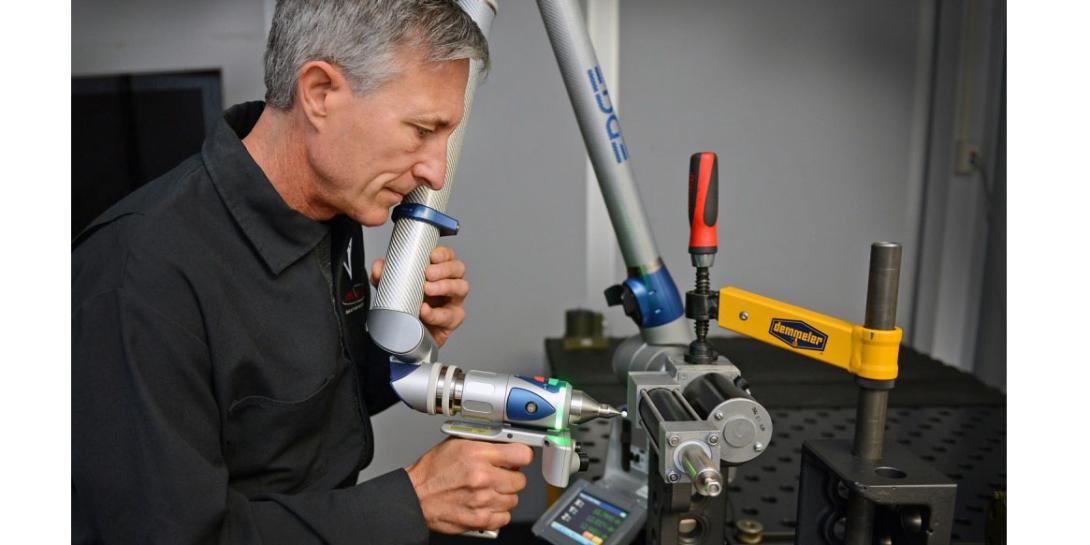 Stephen Cox, chief engineer at SPAWAR Systems Center Pacific’s RESTORE Lab in San Diego, uses a laser scanner. Credit: Alan Antczak