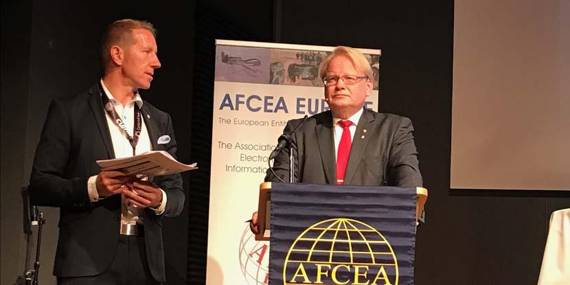 AFCEA Regional Vice President Harri Larsson (l) speaks with Swedish Defense Minister Peter Hultqvist at TechNet Europe 2017 in Stockholm.