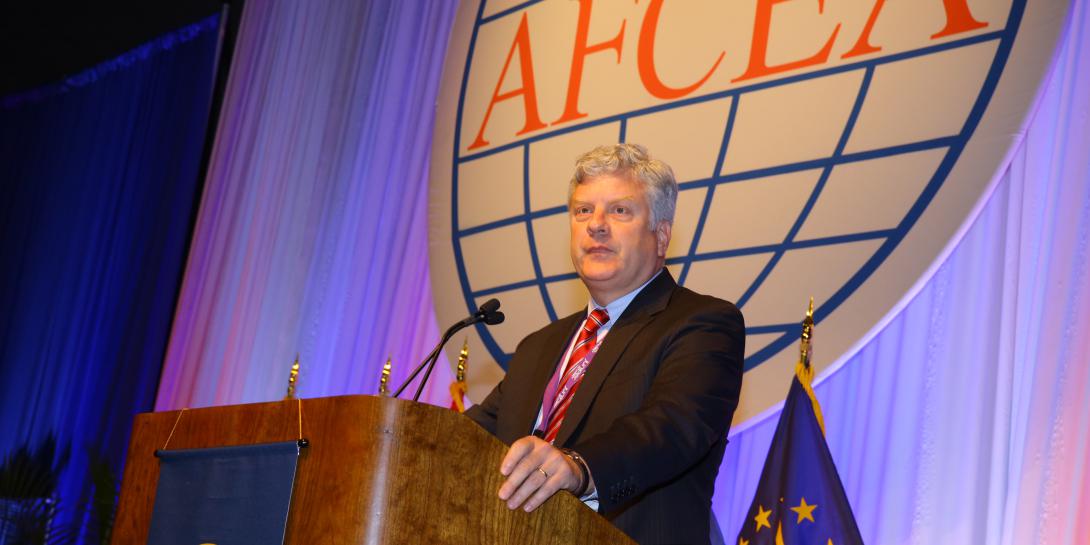 Steven Walker, acting director of DARPA, speaks at AFCEA's Defensive Cyber Operations Symposium.