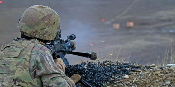 A soldier fires an M240B machine gun during combined arms live-fire training. Soldiers in combat face a great deal of emotional and physical stress, but wearable technologies can monitor their health and performance. Photo by Army Spc. Hannah Tarkelly