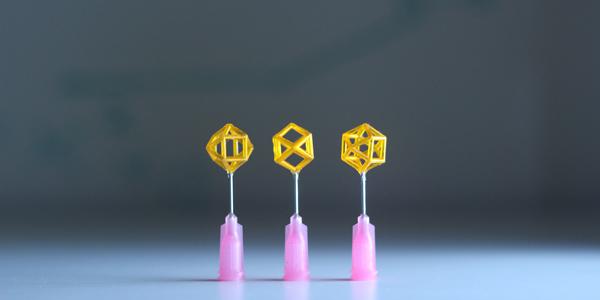 A new class of Lab-developed “field-responsive mechanical metamaterials” (FRMMs) employ a viscous, magnetically responsive fluid that is manually injected into the hollow struts and beams of 3D-printed lattices. The fluid’s ferromagnetic particles located in the core of the beams form chains in response to the magnetic field, which rapidly stiffens the fluid and the lattice structure. Photo by Julie Mancini/LLNL