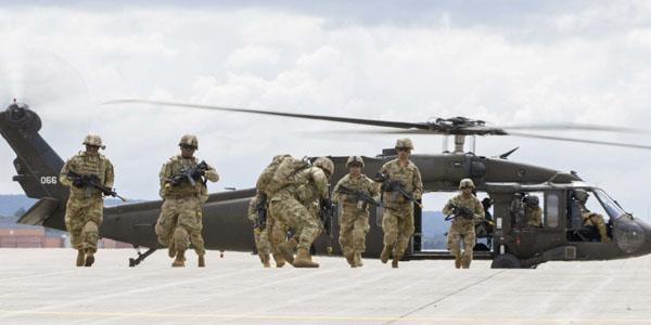 Soldiers from the 10th Mountain Division (LI) perform an air assault demonstration for President Trump during a visit to Fort Drum, New York, on August 13. The demonstration was part of the President’s ceremony to sign the National Defense Authorization Act of 2019, which authorizes funding for U.S. defense and military activities for Fiscal Year 2019. Photo credit: U.S. Army photo by Sgt. Thomas Scaggs.