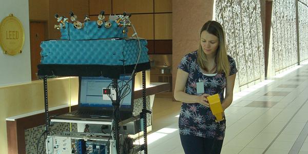 NIST researcher Jelena Senic drives a robot used to measure the performance of different antenna beam patterns. Photo Credit: NIST