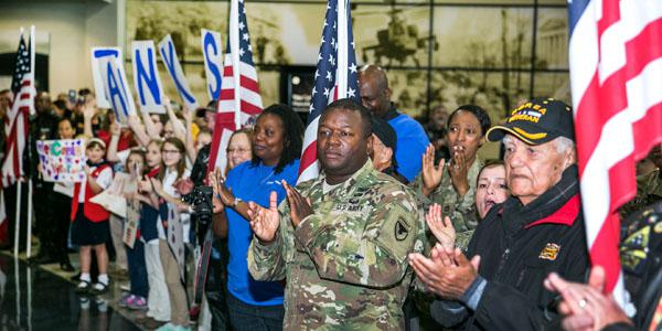 Veterans, active duty military and civilians welcome wounded warriors from all over the country to Huntsville International Airport in Alabama in commemoration of Veterans Week in November. Big data corporation Splunk is partnering with nonprofit veterans’ organizations to make a difference in getting veterans back to work. Army photo by Sgt. 1st Class Teddy Wade.