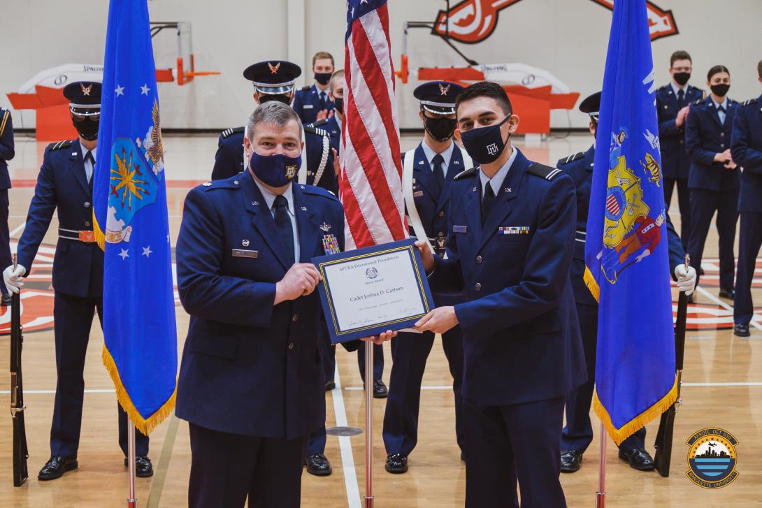 Cadet Joshua Carlson, USAF, Marquette University, pictured with Lt. Col. William Lewis, USAF, is the recipient of an AFCEA ROTC Honor Award.