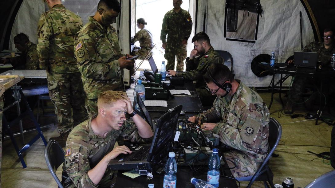 U.S. soldiers with 1st Squadron, 2nd Cavalry Regiment, coordinate troop movements inside of the tactical operations center with Battle Group Poland at Bemowo Piskie Training Area, Poland, as part of NATO exercise Saber Strike 18. This year’s exercise tested allies and partners from 19 countries on their ability to collaborate to deter aggression in the region. U.S. Army photo by Spc. Hubert D. Delany III /22nd Mobile Public Affairs Detachment