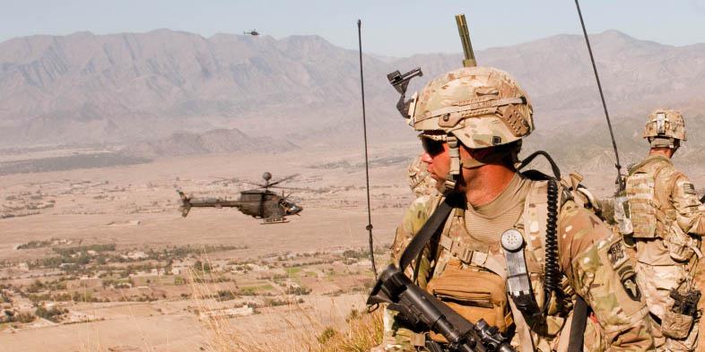 Capt. Jonathan Page, USA, uses the Rifleman Radio and Nett Warrior end user device of the Army’s Network Capability Set 13 at Nangalam Base, Afghanistan. Harris Corporation and Thales Defense and Security Incorporated have been awarded contracts to produce the radio system.
