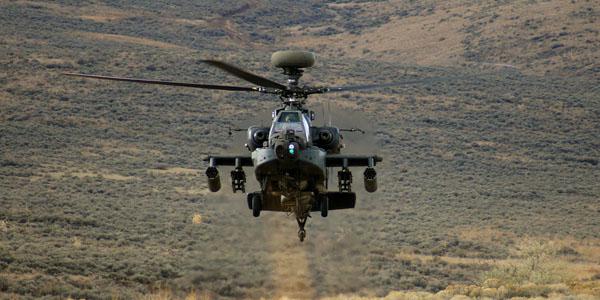 An AH-64 Apache rises from behind a hill during a training exercise at Yakima Training Center, Wash. Intevac Photonics was awarded a $12,626,081 firm-fixed-price contract with options for Electronic Image Intensifier Ship-Set for Lot 4, Apache AH-64D/E Program.