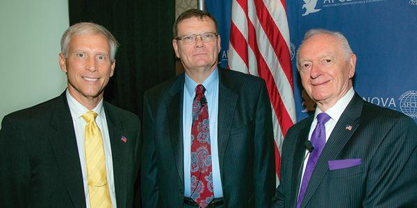 Chuck Corjay (r) and David Scarbalis (l), former chapter president, welcomed speaker Terry Halvorsen, then-Defense Department chief information officer, to the NOVA Chapter's Joint Warfighter IT Day in September 2016.