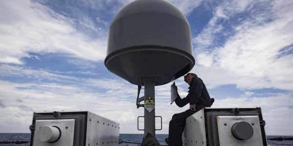Information Systems Technician 2nd Class Austin Vosburg, USN, performs routine maintenance on the USS Zephyr’s commercial broadband satellite program equipment. The maritime family of SATCOM terminals provides high data rate communications to small and large ships.