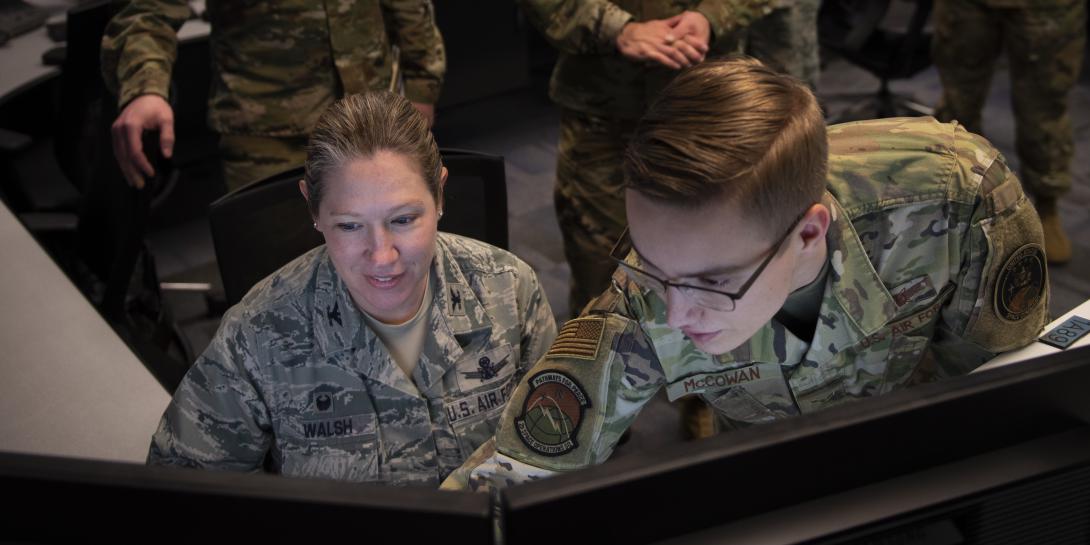 Col. Laurel Walsh, 50th Operations Group commander (l), and Airman 1st Class Michael McCowan, satellite systems operator and mission planner, 2nd Space Operations Squadron, give the final command to decommission Satellite Vehicle Number-36 at Schriever Air Force Base, Colorado in January. As part of steps to create a modern, agile U.S. Space Force, the new service is creating a data management governance council. Credit: U.S. Air Force photo by Airman Amanda Lovelace