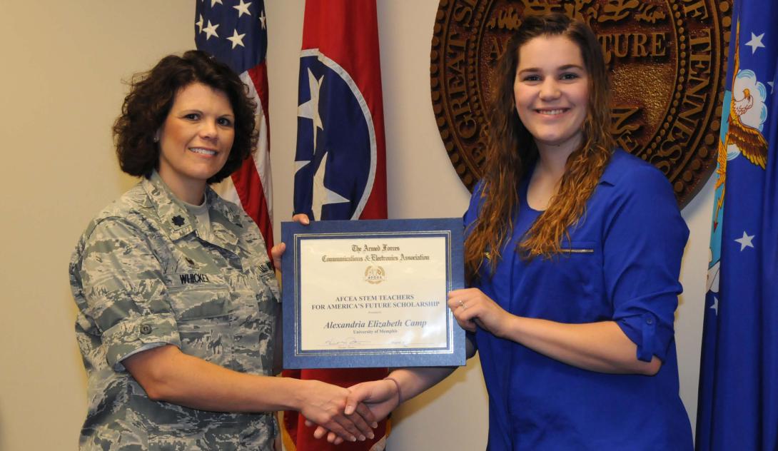 Alexandria Elizabeth Camp of the University of Memphis (r) receives an AFCEA STEM Teachers for America’s Future Scholarship from Lt. Col. Kristina M. Whicker of the Tennessee Air National Guard.