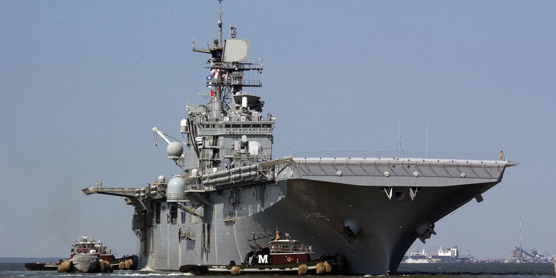 The amphibious assault ship USS Bataan (LHD 5) departs Naval Base Norfolk. It will be one of two ships to initially carry the Information Warfare Platform to sea. Photographer’s Mate 1st Class Shawn Eklund/U.S. Navy​