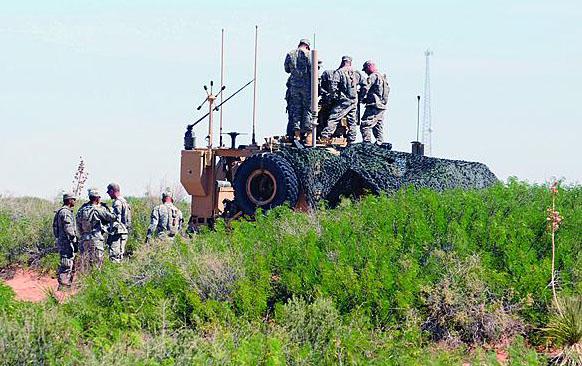 Soldiers in a Network Integration Evaluation set up communications in the New Mexico desert. The greater reliance on mobile communications, particularly the use of smartphones at the warfighter level, is requiring a new approach to information assurance.