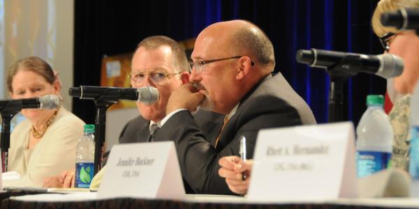 Gary Martin (c), program executive officer for command, control and communications-tactical (PEO C3T), discusses convergence at AFCEA's TechNet Augusta 2015 conference.