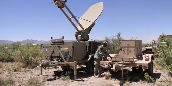A U.S. Army soldier works with a power unit supplying a satellite antenna during an exercise. Military and civilian governments increasingly will benefit from future satellite network systems that are smaller, lighter and simpler and use less power.