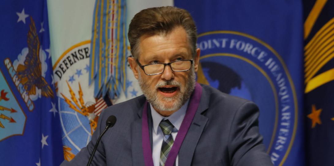 Deputy Assistant Secretary of Defense for Command, Control, Communications, Cyber and Business Systems George Duchak moderates a panel at DCOS.
