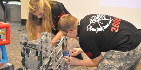 Students from Central Hardin High School in Cecilia, Kentucky, prepare their robotics entry for a Project Lead the Way (PLTW) competition. An AFCEA scholarship funded teacher training for PLTW—a leading provider of K-12 STEM programs—at the University