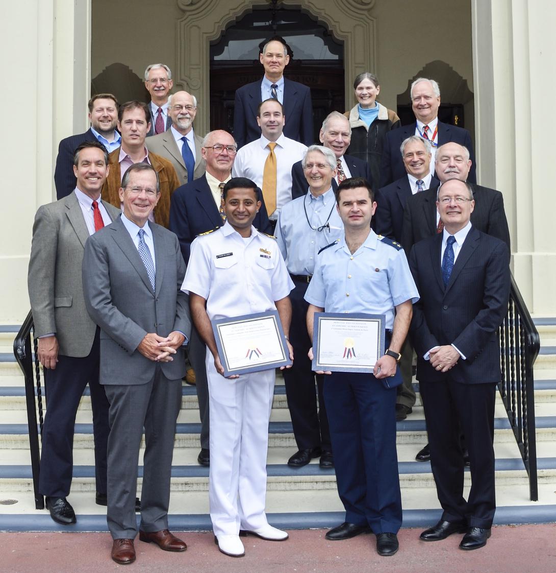 Attending the NPS ceremony recognizing AFCEA academic award winners are Adm. Mike Mullen, USN (Ret.) (front row, left), former chairman of the Joint Chiefs of Staff, and Gen. Keith Alexander, USA (Ret.) (front row, right), former director of the National Security Agency.
