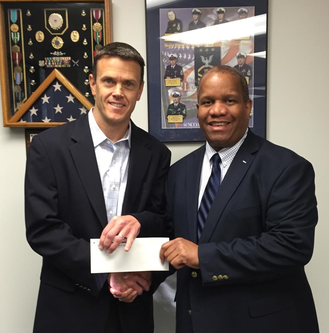 Matt Stratford, managing principal, BridgePhase LLC (l), presents a $3,000 check to AFCEA Educational Foundation Executive Director Vince Patton to sponsor the 2016 BridgePhase STEM Major Scholarship.