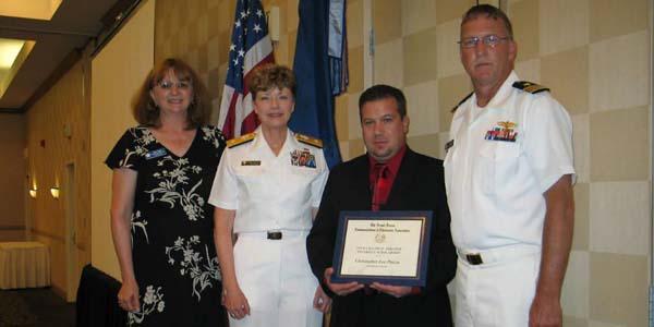 Christopher Piazza (c) is presented the AFCEA STEM Major scholarship award.