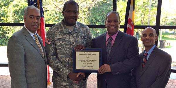 Pfc. Donald Ilobinso, USAR, receives the AFCEA Diversity scholarship award.