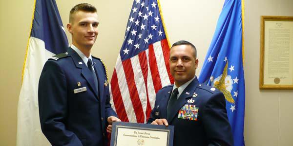 Cadet Robert Crumley (l) is presented the AFCEA Air Force ROTC scholarship award. 