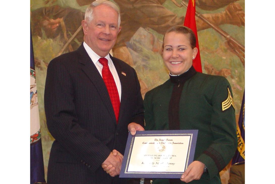 Lt. Gen. John A. Dubia, USA (Ret.), former executive vice president of AFCEA International, presents Kimberly Nicole Denny of Jacksonville, Florida, the first AFCEA Lt. Gen. John A. Dubia, USA (Ret.), Scholarship in November 2014. Cadet Denny is a junior at Mary Baldwin College in Staunton, Virginia, and participates in the ROTC program at nearby Virginia Military Institute, Lexington, Virginia.
