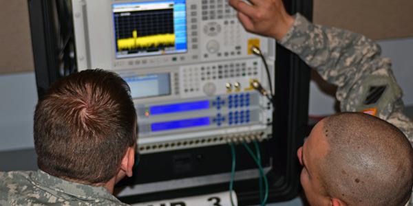 Two soldiers practice using electronic warfare equipment during a joint training exercise. EW often is overlooked, but its importance is increasing with advances in electronics.