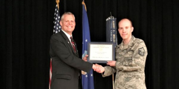 Master Sgt. Jason K. Stover, USAF (r), accepts his AFCEA War Veterans Scholarship from Rick Lipsey, president, Alamo Chapter. Sgt. Stover is pursuing a bachelor’s degree in computer science from Trident University.