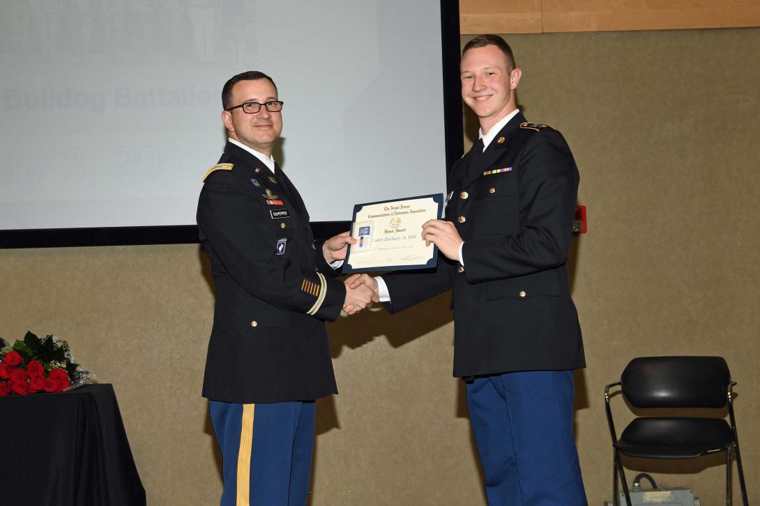 Lt. Col. Tim Culpepper, USA, professor of military science at Gonzaga University (l), presents an Honor Award to Cadet Zachary A. Hill, Army ROTC.