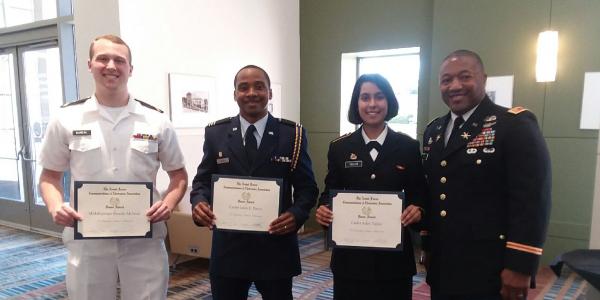 Maj. James Crenshaw, USA, secretary, AFCEA Palmetto Chapter (far r), presents ROTC Honor Awards to University of South Carolina students (l-r) Midshipman Brooks E. McNeal, Naval ROTC; Cadet Leon E. Davis, Air Force ROTC; and Cadet Aditi R. Taylor, Army ROTC.