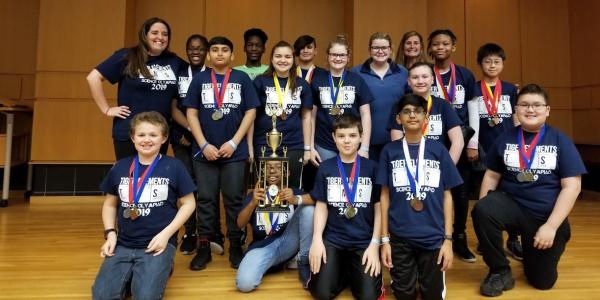 Thomson Middle School’s Olympiad team in Warner Robins, Georgia, won second place in the regional competition after showcasing their skills in STEM areas such as herpetology (r) and engineering and building a boomilever (l). Their victory was made possible by a 2018 Gravely Grant.