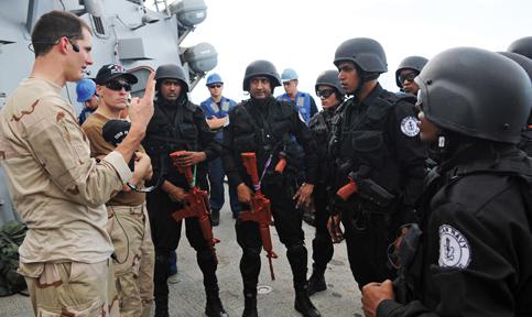 Ensign Timothy Eick, USN, gives a briefing to members of a visit, board, search and seizure team assigned to the Indian navy during a training exercise in 2012. Working with India remains a priority for U.S. Pacific Command after the 2014 elections resulted in a new ruling party in the peninsular nation.