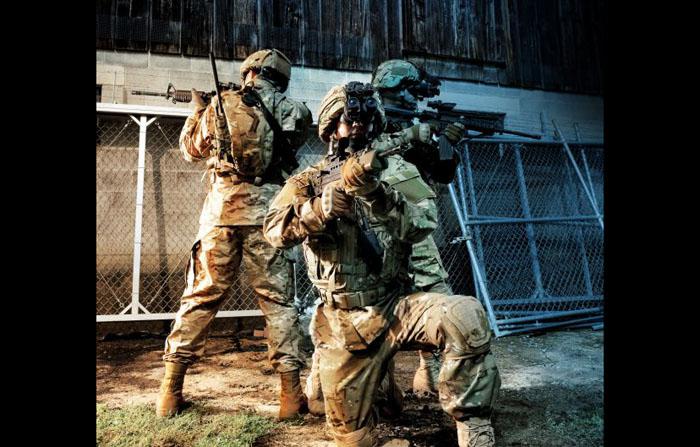 Three soldiers from different forces are equipped with the Integrated Soldier System (ISS) that links the i-Aware TM-NVG night vision system with the SpearNet radio. Combining night vision with radio communications allows warfighters to send real-time battlefield imagery back to their headquarters as well as receive other situational awareness imagery and information from their commands.