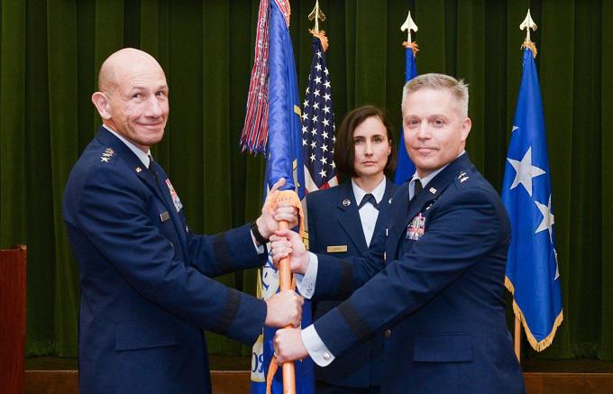 U.S. Air Force Lt. Gen. (Sel.) Timothy Haugh (r) stands with Gen. Mike Holmes (l), Air Combat Command commander, during a change of command ceremony in August at Joint Base San Antonio-Lackland, Texas. Haugh succeeded Maj. Gen. Mary O’Brien (c), who was recently confirmed as the Air Force’s next deputy chief of staff for intelligence, surveillance and reconnaissance and cyber effects operations. Gen. Haugh will now lead the service’s new 16th Air Force.  U.S. Air Force photo by Sharon Singleton.