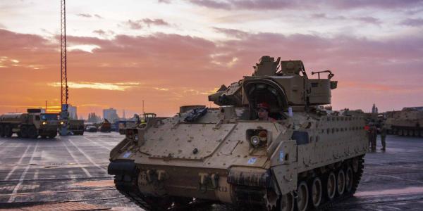 An Army Bradley fighting vehicle armored personnel carrier waits to board a vessel at the port of Bremerhaven, Germany, last October, while supporting Atlantic Resolve, a mission demonstrating continued U.S. support for NATO allies in Europe. The Joint Support and Enabling Command (JSEC) will follow the lead of the Supreme Allied Commander Europe, or SACEUR, in providing deployment assistance in Europe to the U.S. and other NATO militaries.  U.S. Army Sgt. Thomas Mort