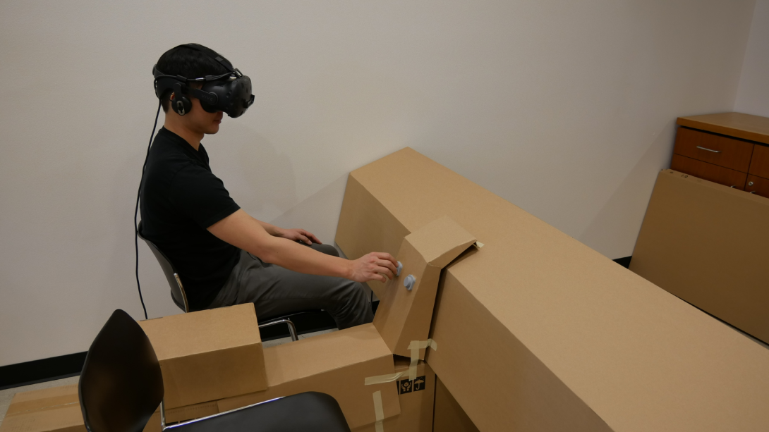 Clement Zheng, doctoral candidate, lecturer and researcher at the University of Colorado Boulder’s ATLAS Institute, tests a preliminary project using a cardboard structure combined with virtual reality and a haptic interface. Leithinger, who also directs the ATLAS Institute’s THING Lab, emphasizes that fast prototyping abilities using inexpensive materials can drive innovation in such interfaces.
