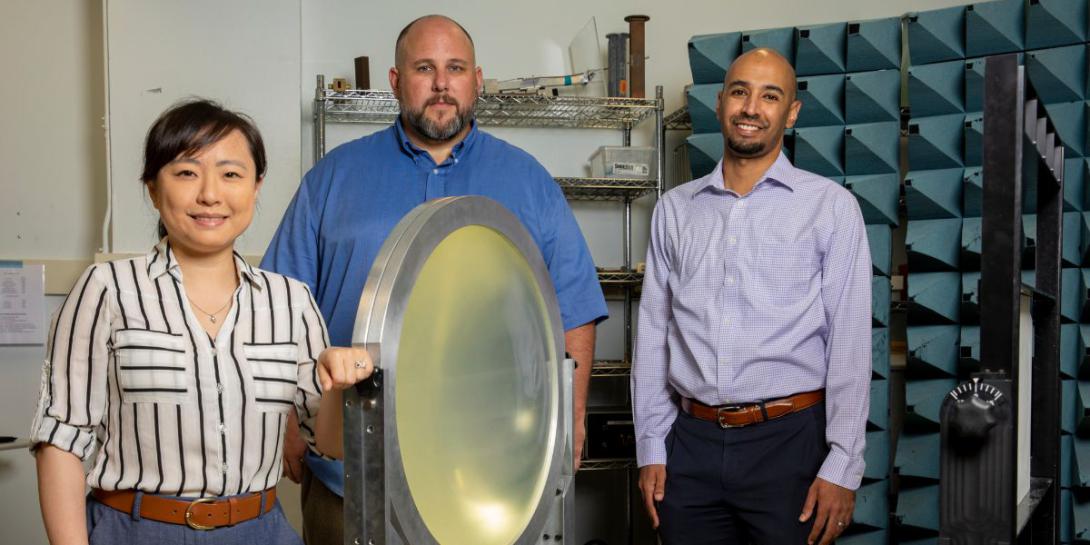 Ellen Yi Chen Mazumdar, Aaron Stebner and Anirban Mazumdar, principal investigators for Georgia Tech’s University Consortium for Applied Hypersonics research, stand next to a free-space focused beam characterization system for studying radome materials that can be used for hypersonics. Sam McNeil, GTRI