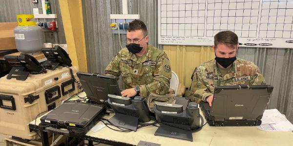 Sgt. Anton Mills, USA, senior transmission system operator-maintainer, and Spc. Ryan Frederick, USA, transmission systems operator maintainer, validate the hybrid in preparation for Dragoon Ready 2021.  Capt. Dallas R. Villarreal, USA