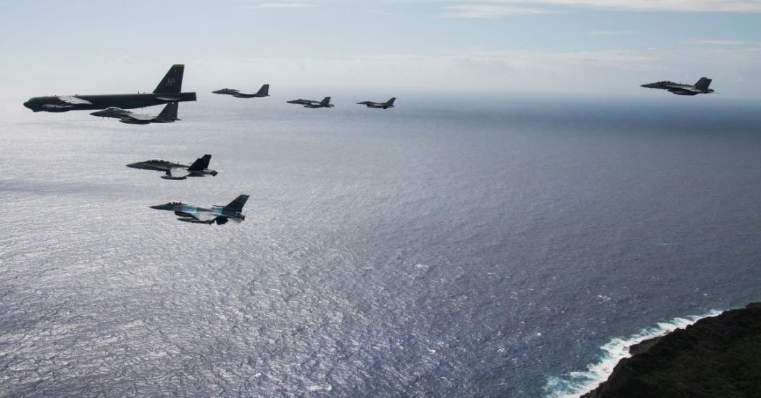 An eight-ship joint coalition formation flies over Andersen Air Force Base, Guam, during exercise Cope North 2020 in February 2020. Guam is proving to be a strategic hub for the United States’ efforts in the Indo-Pacific region, the military’s priority theater.  U.S. Air Force photo by Master Sgt. Larry E. Reid Jr.