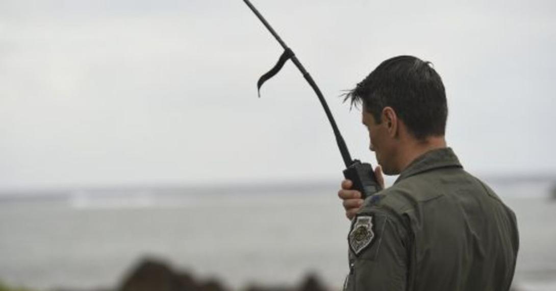 The director of operations of the 9th Expeditionary Bomb Squadron speaks to the aircrew of a U.S. Air Force B-1B Lancer during a Veterans Day flyover at Asan Invasion Beach on Guam, November 11, 2020. Communications capabilites, whether they are for a ceremonial flyover or for vital military operations are necessary to Guam and the vast and remote Indo-Pacific region, and are something that the Defense Information Systems Agency is investing in heavilly.  U.S. Air Force photo by Staff Sgt. David Owsianka
