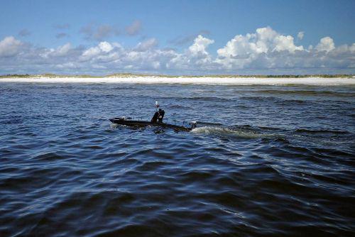 The U.S. Naval Research Laboratory (NRL’s) Ocean Sciences Division tests the Mantas unmanned surface vehicle’s (USV’s) ability to conduct a detailed survey near Panama City Beach, Florida, in November. The Navy is relying on help from NRL and other laboratories to build a cadre of USVs and unmanned underwater vehicles as a fleet multiplier.  NRL/Daniel Parry