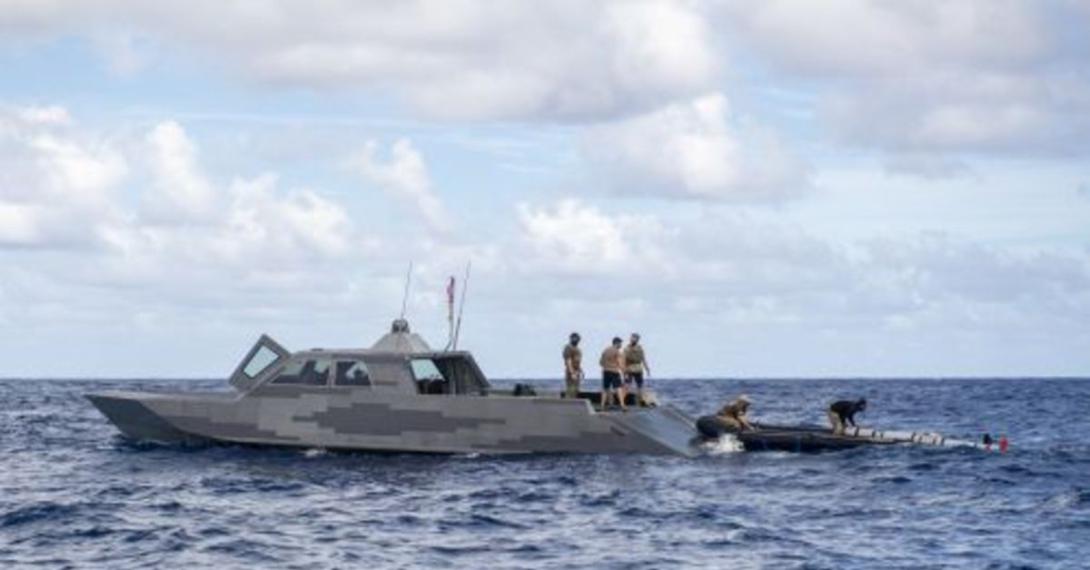Sailors deployed with the expeditionary mine countermeasures capability of Task Force 75 and Special Warfare Combatant-Craft Crewmen recover a MK 18 Mod 2 unmanned underwater vehicle (UUV) onto a combatant craft in Pago Bay, Guam in November. The Navy is working to add considerable unmanned capability to the fleet with UUVs and unmanned surface vehicles of all sizes to support a number of naval missions.  U.S. Navy photo by Petty Officer 1st Class Adam Brock