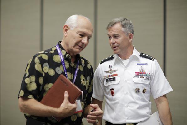 Lt. Gen. Bryan P. Fenton, USA, speaks with an attendee at TechNet Asia-Pacific.